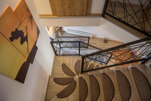 an overhead view of a winding staircase in a house at Casa Valley Paradiso - Jahorina in Jahorina