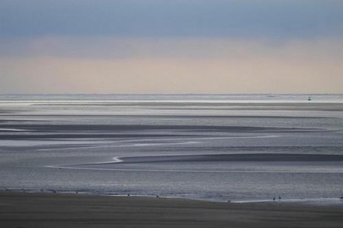 a view of the ocean from the beach at Les Dunes Blanches in Le Crotoy