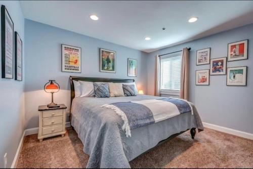 a bedroom with a bed and a lamp on a night stand at Condo in the Heart of Nashville - unit794 in Nashville