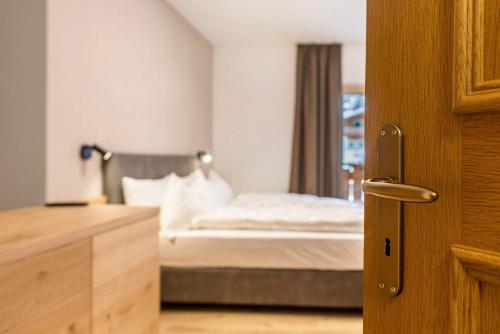 Ένα ή περισσότερα κρεβάτια σε δωμάτιο στο Kamerloy Apartments D