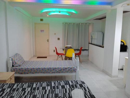 a living room with a couch and a table at Apartamento A 43 Flat Centro in Mogi das Cruzes