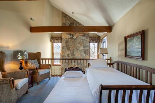 two beds in a room with a balcony at Misty Lake Hot Tub w Lake Access in Oak Ridge