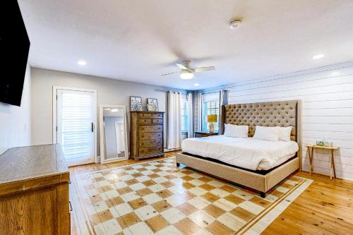 a bedroom with a bed and a ceiling fan at Great Marsh House in Essex