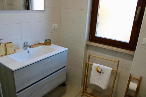 a bathroom with a sink and a mirror at C’era Una Volta Affittacamere in Colle di Tora