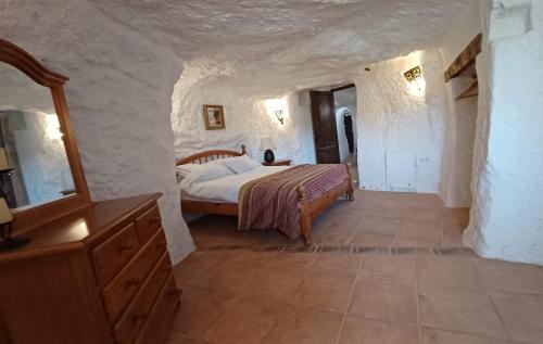 Postel nebo postele na pokoji v ubytování Cueva la vega