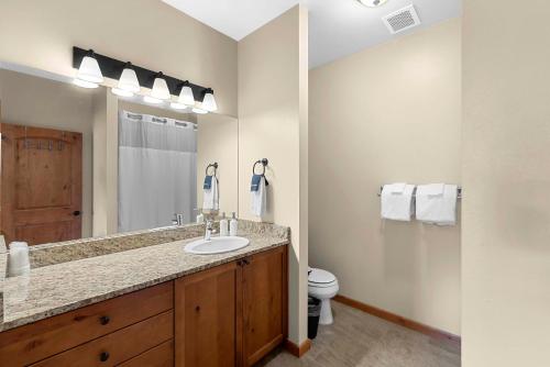 a bathroom with a sink and a toilet at Trails Edge Condo Townhouse A in Leavenworth