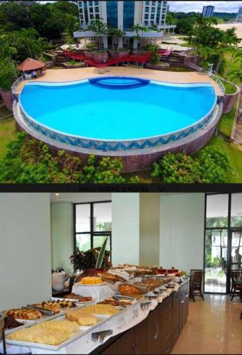a buffet of food next to a swimming pool at Tropical Executive Hotel Flats in Manaus