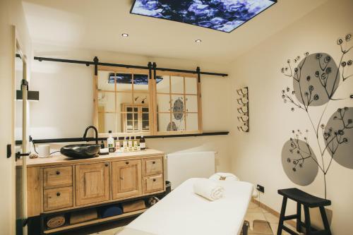 a kitchen with a skylight and a table in a room at Hotel Lauterbad in Freudenstadt