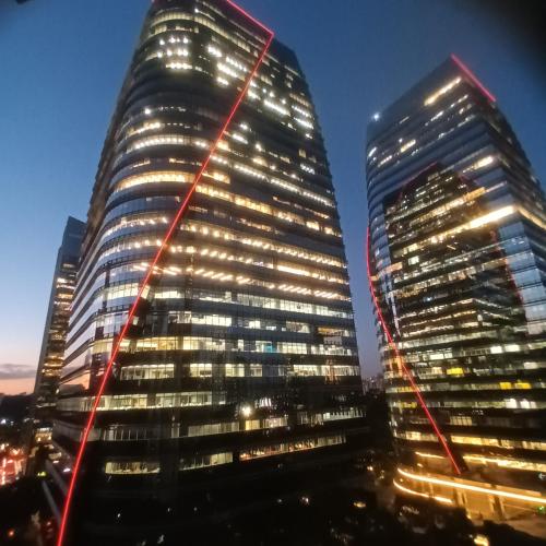 two tall buildings in a city at night at INCRIVEL Flat proximo Shoppings JK e Vila Olimpia in Sao Paulo