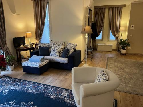 a living room with a couch and a chair at Relais Dei Mandorli in Bergamo