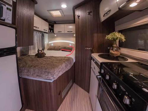 a small room with a bed in an rv at Zebra motorhome hire in Ravensworth