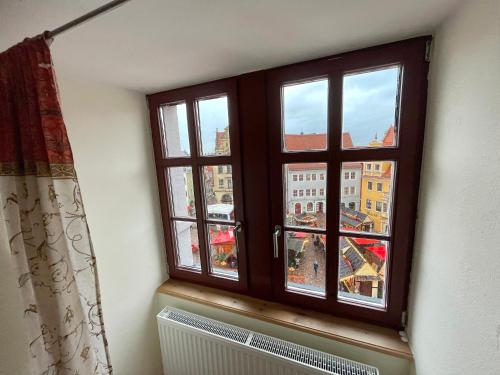 a window with a view of a city at Pension am Markt Meißen in Meißen