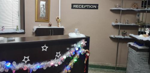 a room with a reception counter with stars on it at ASA Hotel in Yerevan