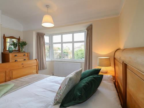 a bedroom with a bed and a window at 2 Gladstone Avenue in Melton Mowbray