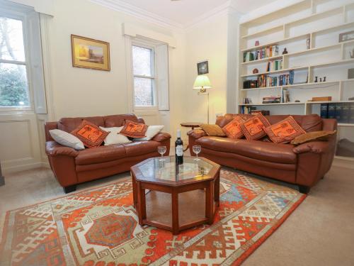 a living room with two couches and a coffee table at Leazes Cottage in Durham