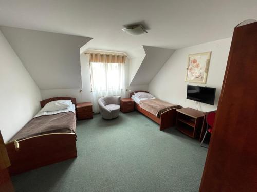 Ένα ή περισσότερα κρεβάτια σε δωμάτιο στο Hotel August