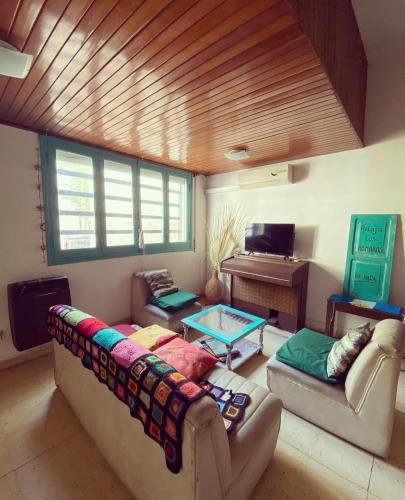 a living room with a couch and a table at La Mitre in Santiago del Estero