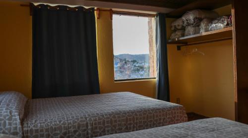 Postel nebo postele na pokoji v ubytování Posada La Mora - Hospedaje Panoramico