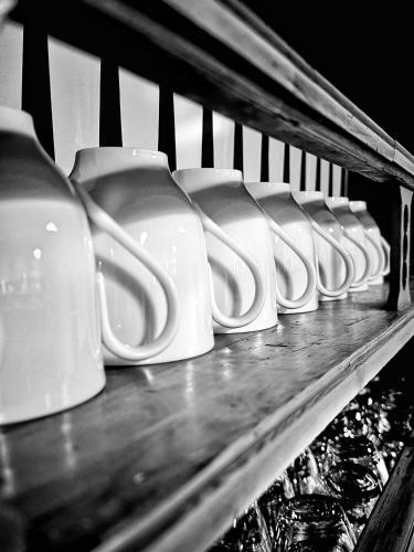 a row of white urinals on a shelf at Maison d'hôte Les Allois in Limoges