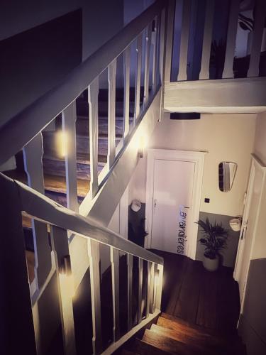 a staircase in a house with lights on it at Maison d'hôte Les Allois in Limoges