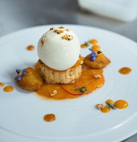 a dessert on a white plate with food on it at Grand Hôtel Du Parc - Teritoria in Aix-les-Bains