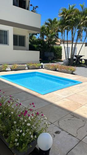 a swimming pool in front of a house at Miau de Pipa in Pipa