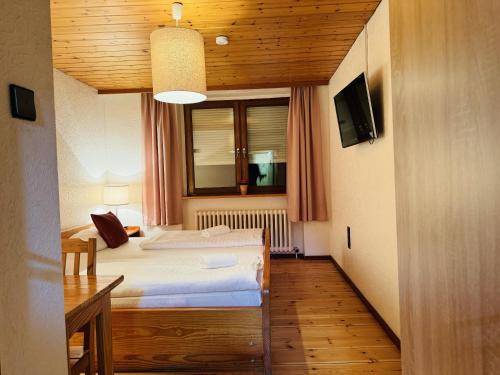 a small room with a bed and a window at Hotel Nest in Berlin