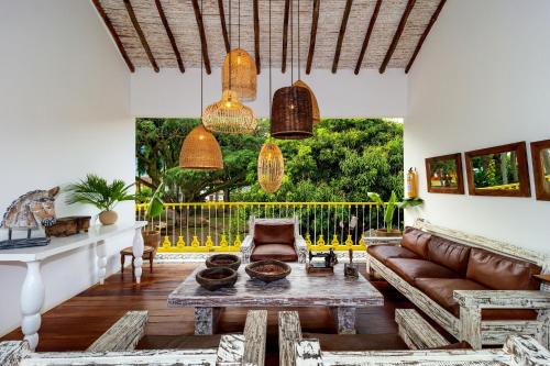 a living room with a couch and a table at Hotel Fundadores en Cauca Viejo Fundadores in Jericó