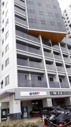 a large white building with a largeartments at The SPLENDOR comfortable living by Awsom Phil in Manila