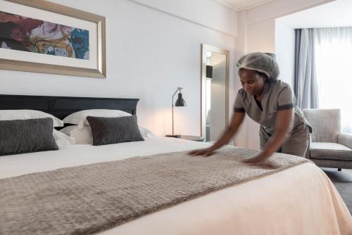 Cama o camas de una habitación en Hotel Avenida