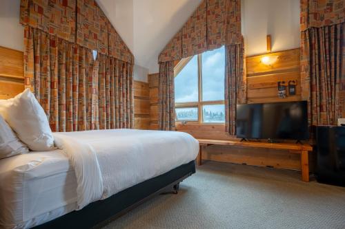 Postel nebo postele na pokoji v ubytování Basecamp Lodge Golden