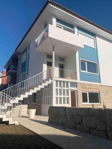 a large house with stairs in front of it at Porto Aldoar Boutique Flat Garden -Duarte in Porto