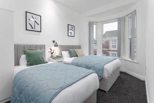 En eller flere senge i et værelse på Host Liverpool - Cozy Home near Univ & Hospital,1mi to Station