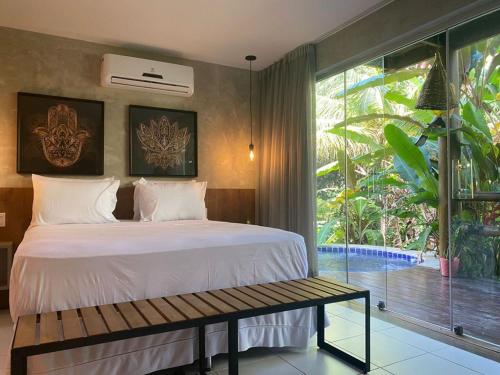 A bed or beds in a room at Prime Villas do pratagy