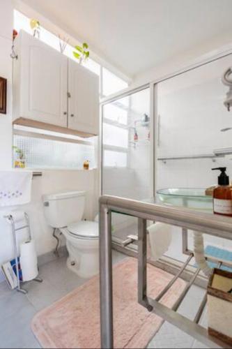 a bathroom with a toilet and a glass sink at Casa Itzae B&B Polanquito Dog Friendly in Mexico City