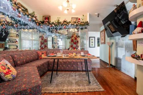 a living room with a couch and a table at Casa Itzae B&B Polanquito Dog Friendly in Mexico City