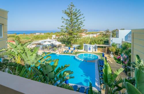 a view of the pool from the balcony of a resort at Futura Hotel in Maleme