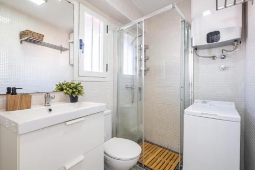 a bathroom with a toilet sink and a shower at Coblanca 5-15-4 Apartment Levante Beach in Benidorm