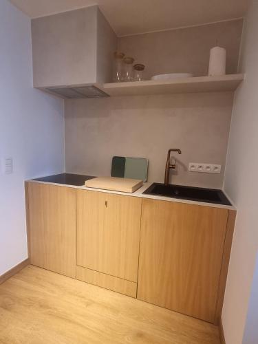 a kitchen with a sink and a counter top at Beautiful Bruges in Zeebrugge
