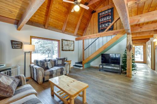 a living room with a couch and a tv at Peaceful Donnelly Retreat Less Than 1 Mi to Lake Cascade! in Donnelly