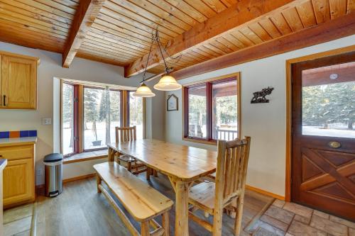 a dining room with a wooden table and chairs at Peaceful Donnelly Retreat Less Than 1 Mi to Lake Cascade! in Donnelly