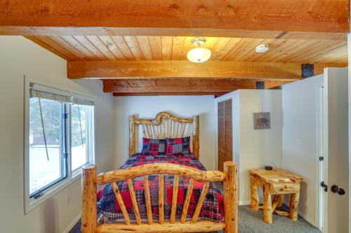 a bedroom with a bed and a wooden ceiling at Peaceful Donnelly Retreat Less Than 1 Mi to Lake Cascade! in Donnelly