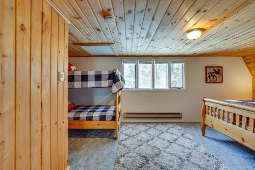 a bedroom with a bunk bed and a window at Peaceful Donnelly Retreat Less Than 1 Mi to Lake Cascade! in Donnelly