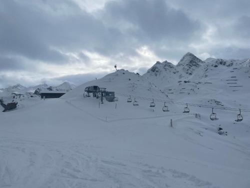 a snow covered mountain with a ski lift at Apartment Sonnenlicht in Schruns-Tschagguns