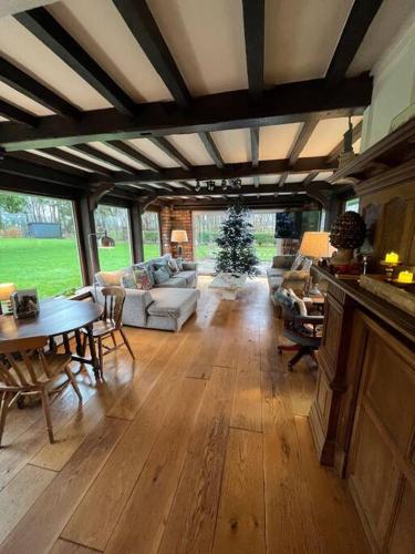 a large living room with a table and chairs at Brownhills in Eaton