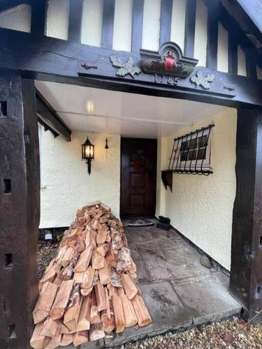 a pile of wood on the floor of a house at Brownhills in Eaton