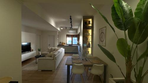 a living room with a couch and a table at Gjirokastra Design Apartments in Gjirokastër