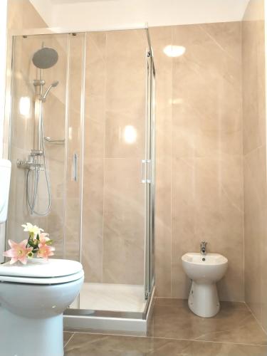 a bathroom with a shower with a toilet and a sink at Arcobaleno Rooms Mestre-Venezia in Mestre