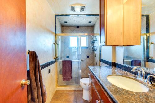 a bathroom with a toilet and a sink and a shower at Momos Place about 7 Mi to Colorado Convention Center! in Denver