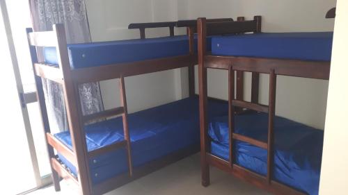 Μία ή περισσότερες κουκέτες σε δωμάτιο στο Apto na Prainha a 4 minutos da Praia